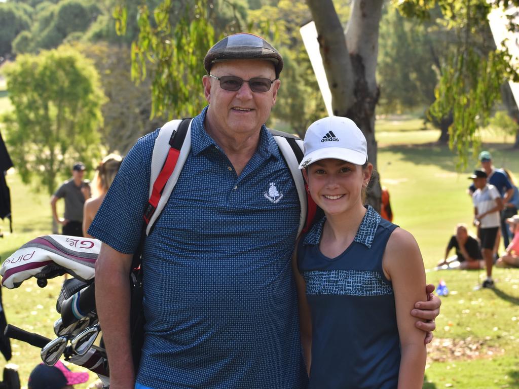 Victoria's Jordyn Wilson with grandfather Glenn Kerr at the Rockhampton Golf Club in the lead-up to the US Kids Golf Foundation Australian Open being played on September 27 and 28.