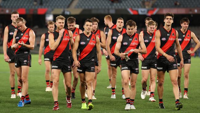 The Bombers walk off after the big loss to the Dockers. Picture: Robert Cianflone/Getty Images