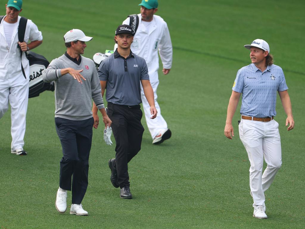 (L-R) Adam Scott, Harrison Crowe and Cameron Smith walk down the third fairway during a practice round prior to the 2023 Masters Tournament. Picture: Getty Images