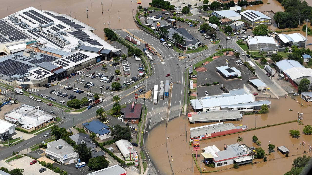 Floodwaters cut off the highway through Gympie on February 27, 2022. Photo: Bradley Kanaris/Getty Images