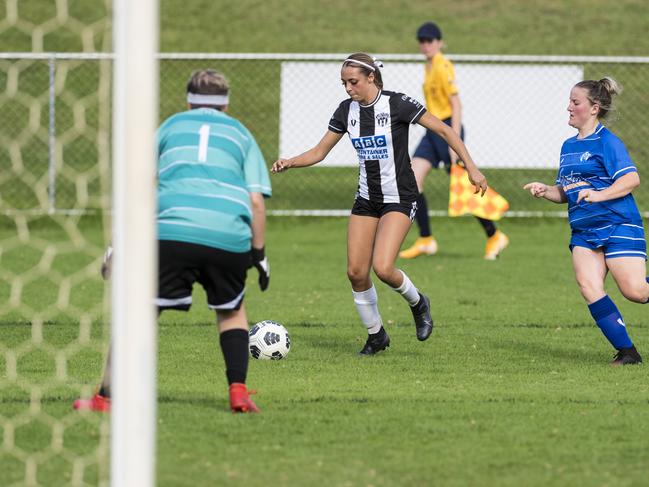 Willowburn player Hayley Gray (centre) drives against Rockville Rovers in Toowoomba Football League Premier Women round one at West Wanderers, Sunday, March 14, 2021. Picture: Kevin Farmer