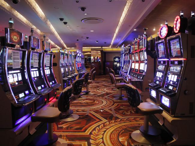 Chairs have been removed at some electronic slot machines to maintain social distancing between players at a closed Caesars Palace hotel and casino, Las Vegas. Picture: AP Photo