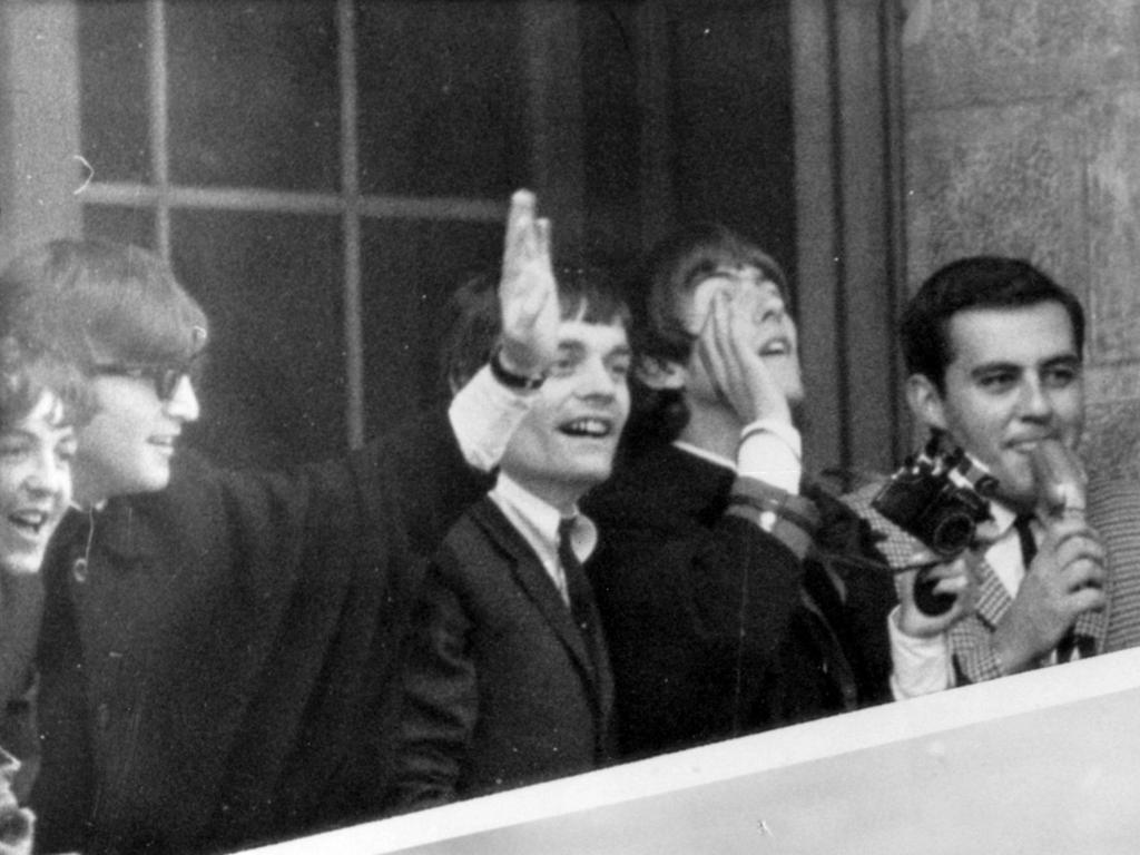 Radio presenter Bob Francis with The Beatles during their historic Adelaide visit in 1964.