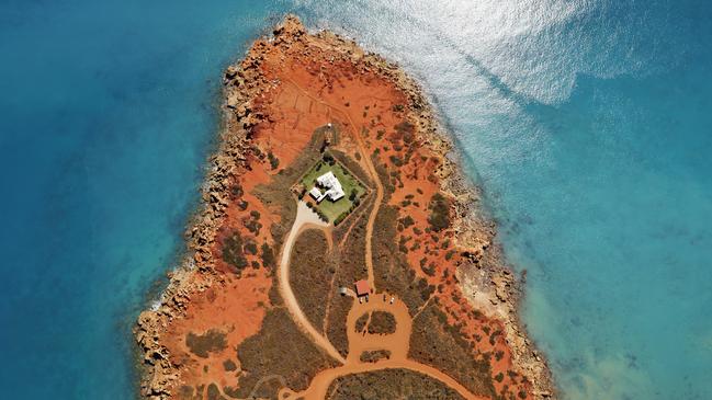 Red earth and pristine blue waters feature at the homestead at Gantheaume Point near Broome.