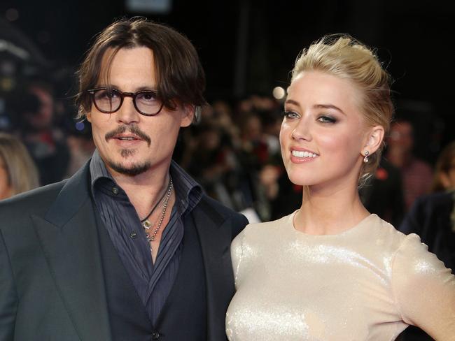 Johnny Depp with Amber Heard in 2011. Picture: AP Photo/Joel Ryan