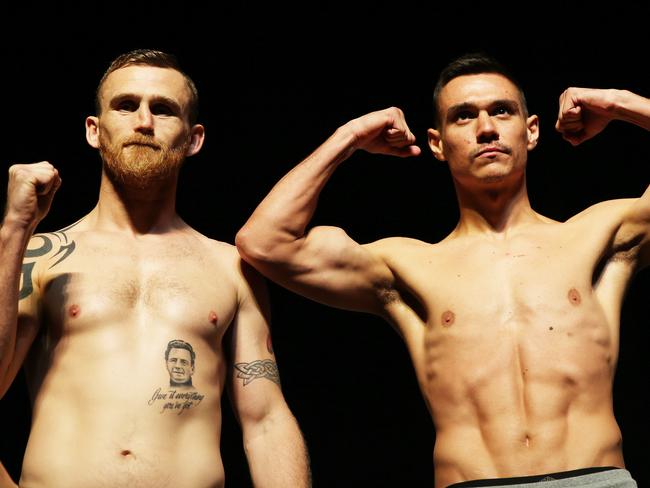 NEWCASTLE, AUSTRALIA - NewsWire Photos - March 30, 2021.Tim Tszyu and Dennis Hogan face off and officially weigh in at Newcastle Civic Theatre ahead of tomorrow night's Steel City Boxing Showdown at Newcastle Entertainment Centre.   Picture: NCA NewsWire / Peter Lorimer.