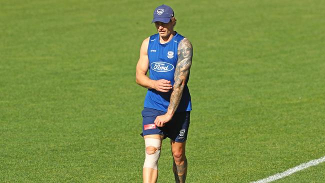 Injured Tom Stewart walking laps at Cats training. Picture: Alison Wynd