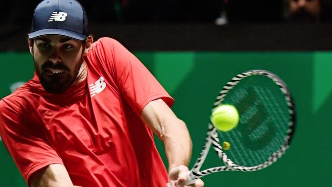 Reilly Opelka of the US returns the ball to Canada's Vasek Pospisil during the singles tennis match between USA and Canada at the Davis Cup Madrid Finals 2019 in Madrid on November 19, 2019. (Photo by JAVIER SORIANO / AFP)