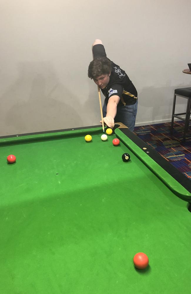 Damian Crook enjoyed playing pool with son Declan Laverty (pictured).