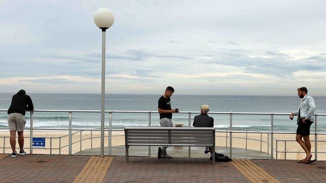 Bondi residents adhere to social-distancing rules on Monday. Picture: Jane Dempster