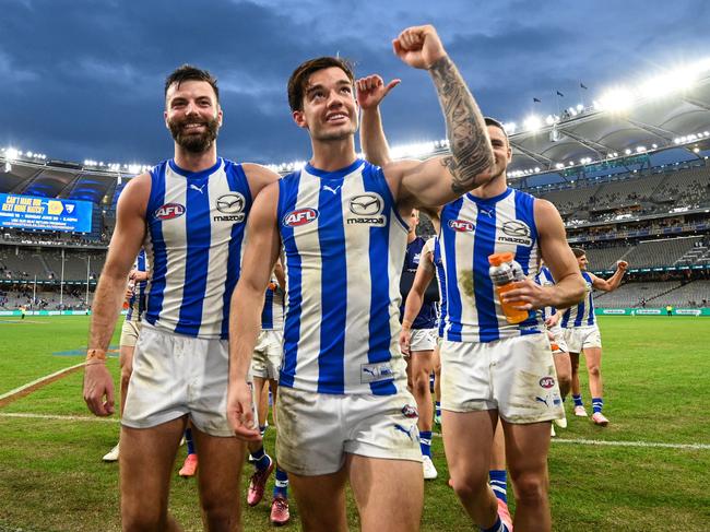 Jy Simpkin leads the Roos off after the win. Picture: Daniel Carson/AFL Photos