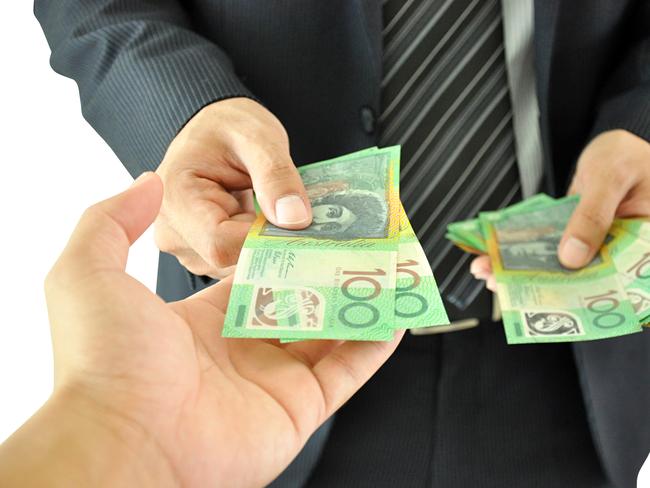 Businessman hand giving money - Australian dollars