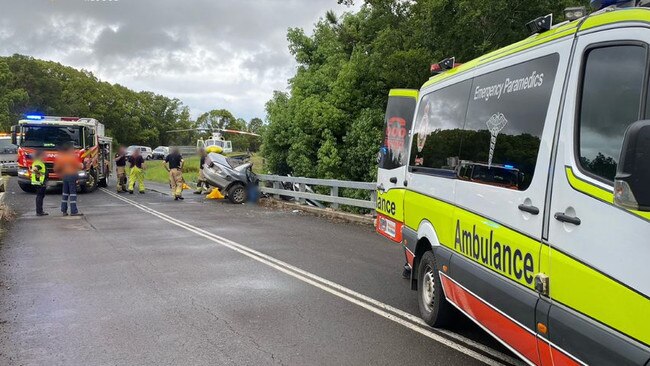 A man has been flown to hospital after the car he was driving smashed into the guardrail of a bridge. Picture: Sunshine Coast RACQ LifeFlight