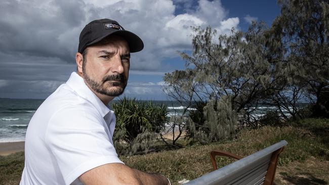 Michael Stewart at his son Balin Stewart’s memorial seat at Buddina beach. Picture: Lachie Millard