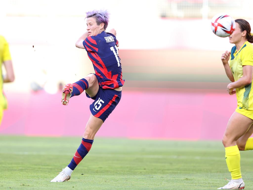 Megan Rapinoe smashes it into the top corner. (Photo by Elsa/Getty Images)