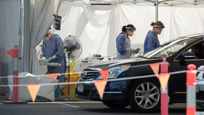 Brisbane residents line up to get COVID tests ahead of a three-day lockdown. Picture: Brad Fleet