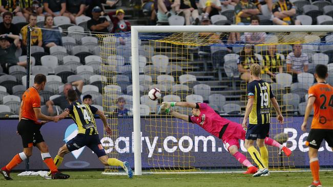 Luke De Vere of the Roar heads home his first goal in the A-League in more than two years. Picture: AAO