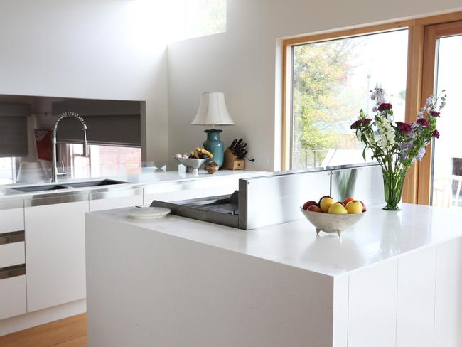 A section of the bright, sun-filled kitchen, which overlooks the sitting room.