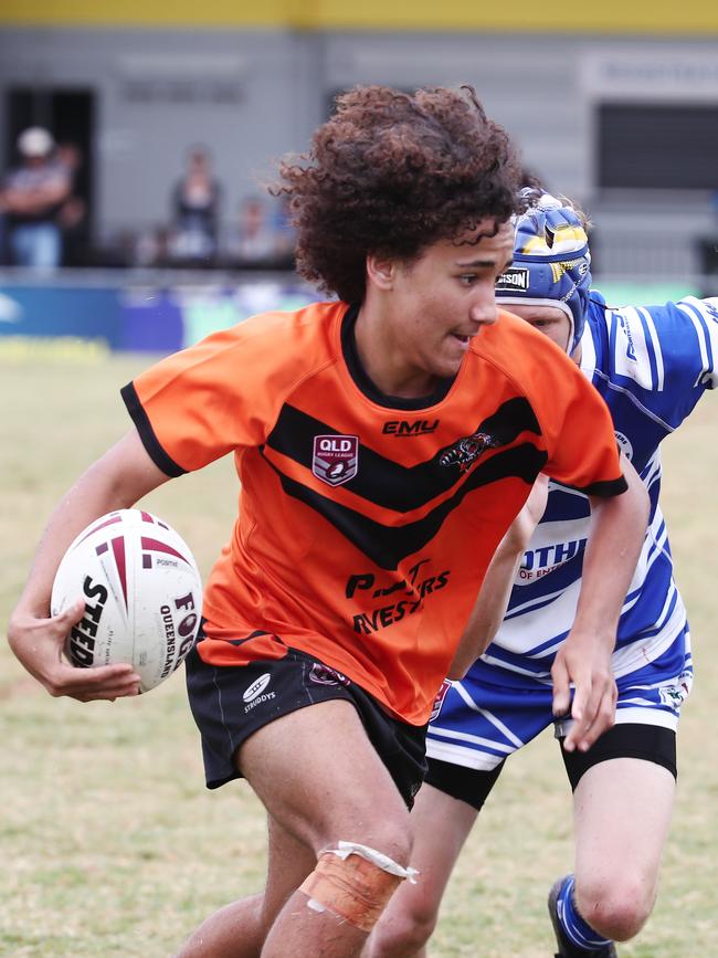 Tully's Max Peach shows some pace in the Cairns and District Junior Rugby League match between Cairns Brothers and Tully Tigers, held at Jones Park, Westcourt. PICTURE: BRENDAN RADKE