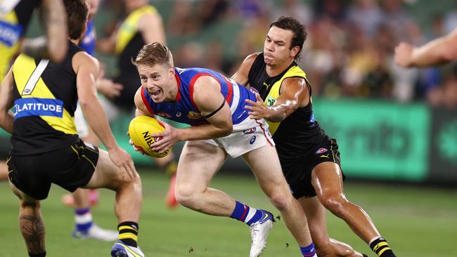 Bulldog Lachie Hunter is tackled by Daniel Rioli. Picture: Michael Klein