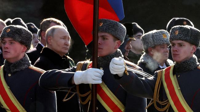 Vladimir Putin attends a wreath-laying ceremony at the Eternal Flame and the Unknown Soldier's Grave during an event marking Defender of the Fatherland Day in Moscow. Picture: AFP.