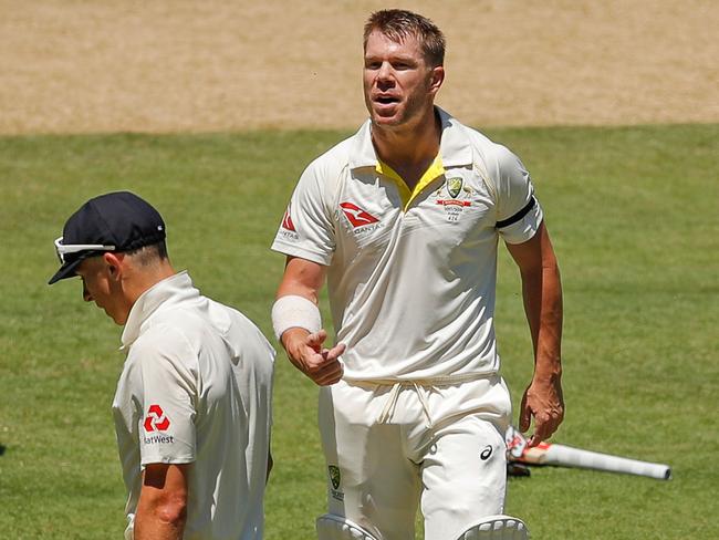 David Warner and Tom Curran exchange pleasantries. Picture: Getty Images