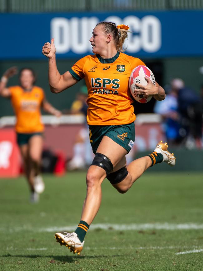 Maddison Levi of Australia reacts as she runs with the ball to score a try in a semifinal match against France during the HSBC SVNS rugby tournament on December 3, 2023 in Dubai, United Arab Emirates. (Photo by Martin Dokoupil/Getty Images)