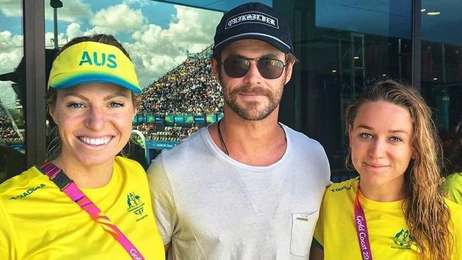 Hollywood star Chris Hemsworth, pictured with Aussie swimmers Emily Seebohm and Tessa Wallace, heads Greg Davis’ list of the best people to have a beer with at the Commonwealth Games.