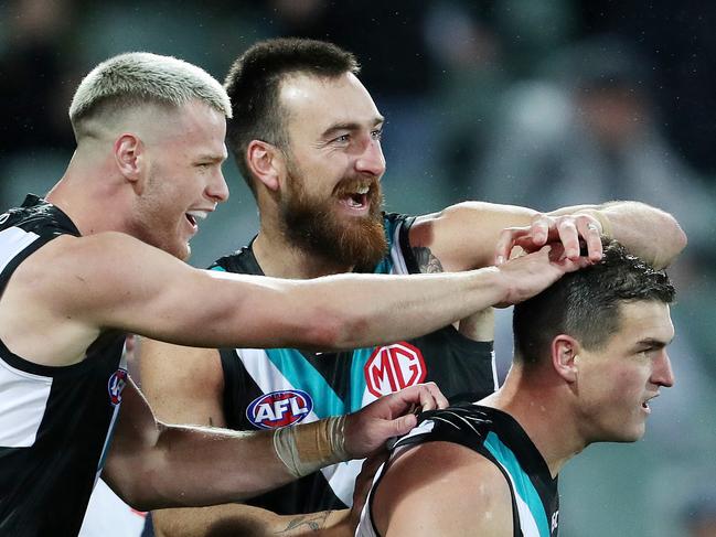 AFL - Saturday, 8th August, 2020 - Port Adelaide v Richmond at the Adelaide Oval. Port Adelaide's Tom Rockliff celebrates his goal with Peter Ladhams and Charlie Dixon Picture: Sarah Reed