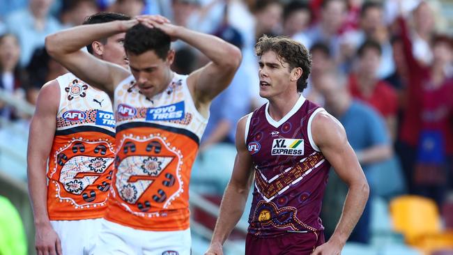 BRISBANE, AUSTRALIA – MAY 28: Deven Robertson of the Lions celebrates a goal during the round 11 AFL match between the Brisbane Lions and the Greater Western Sydney Giants at The Gabba on May 28, 2022 in Brisbane, Australia. (Photo by Chris Hyde/AFL Photos/via Getty Images )