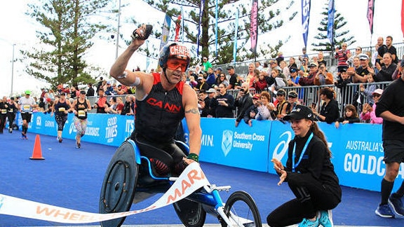 Bill Chaffey crosses the line in the Wheelchair Marathon. Picture: Gold Coast Marathon