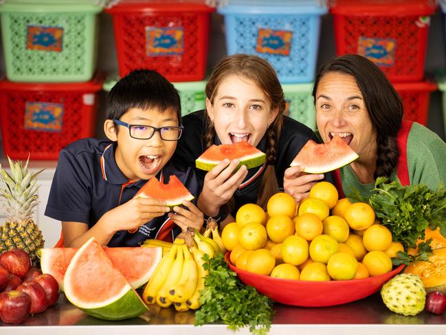 A love of fresh food: The Stephanie Alexander Kitchen Garden Foundation was recently announced as a partner in the Victorian Government’s Healthy Kids, Healthy Futures strategy. Healthy Kids Adviser Belinda Nowakowski pictured with Keysborough Gardens Primary students Ryan Ly and Mya Durakovic. Picture: Mark Stewart