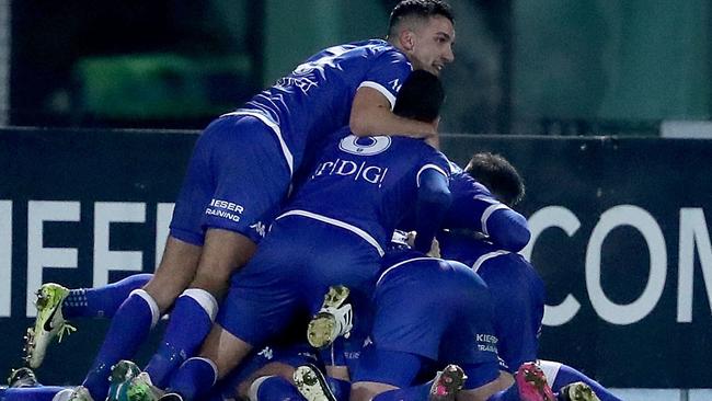 South Melbourne players celebrate their win over Edgeworth Eagles.