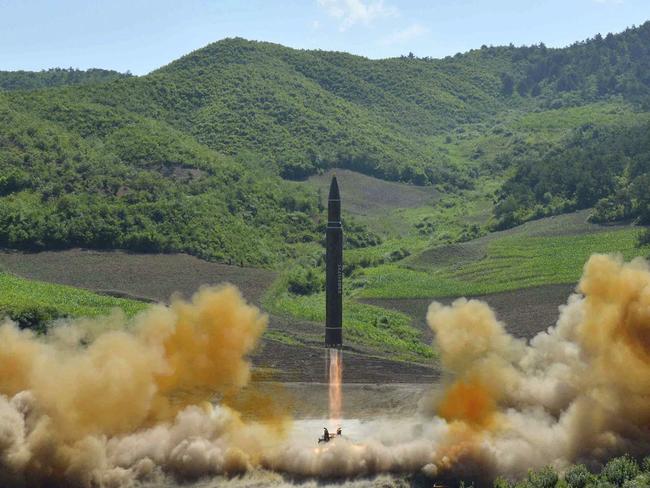 FILE- In this July 4, 2017, file photo distributed by the North Korean government shows what was said to be the launch of a Hwasong-14 intercontinental ballistic missile, ICBM, in North Korea's northwest. North Korea has been condemned and sanctioned for its nuclear ambitions, yet has still received food, fuel and other aid from its neighbors and adversaries for decades. How does the small, isolated country keep getting what it wants and needs to prevent its collapse? (Korean Central News Agency/Korea News Service via AP, File)