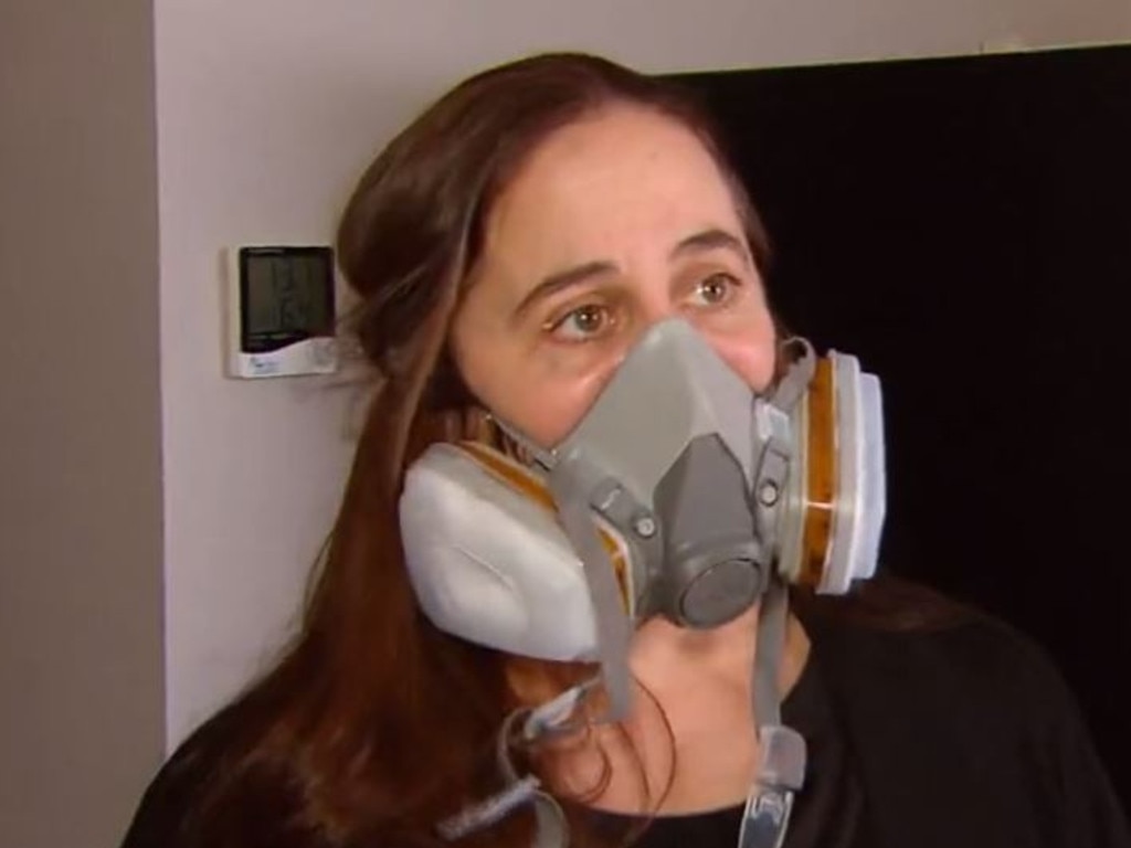 Patsy is too afraid to set foot inside the house without respiratory protection. Picture: ACA