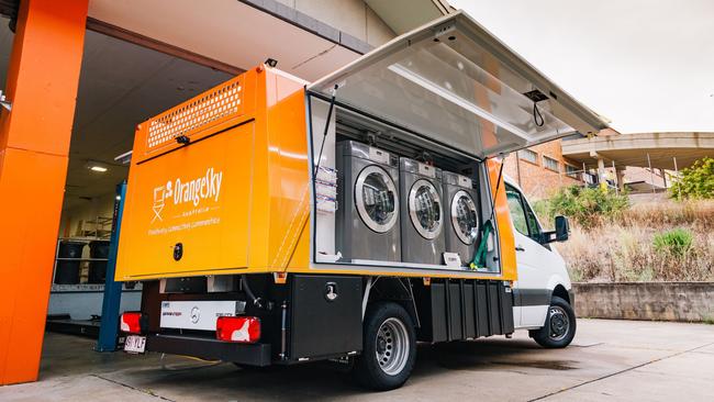 Orange Sky Australia has extended its services to Cairns, launching a free mobile laundry service for people experiencing homelessness. Pictured is the new custom-built Cairns van.