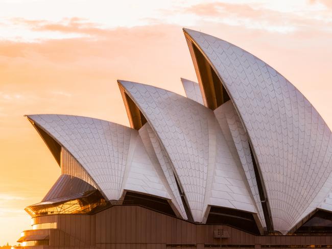 Sydney, Australia - March 25, 2018: Sydney Opera House close-up view with sunrise sky on the background.