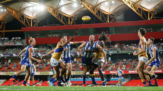 West Coast and North Melbourne battle it out at Metricon Stadium