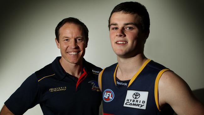 Crouch with then Crows coach Brenton Sanderson after being drafted in 2011.