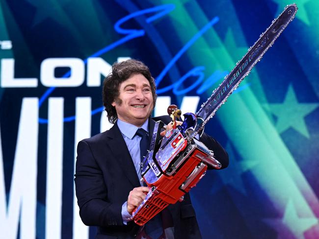 Argentine President Javier Milei holds the chainsaw engraved with the words ”Long live freedom, damn it”. Picture: Saul Loeb / AFP