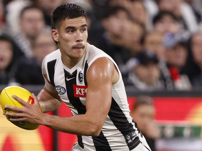 MELBOURNE, AUSTRALIA - MARCH 21: Reef McInnes of the Magpies runs with the ball during the round two AFL match between St Kilda Saints and Collingwood Magpies at Melbourne Cricket Ground, on March 21, 2024, in Melbourne, Australia. (Photo by Darrian Traynor/Getty Images)