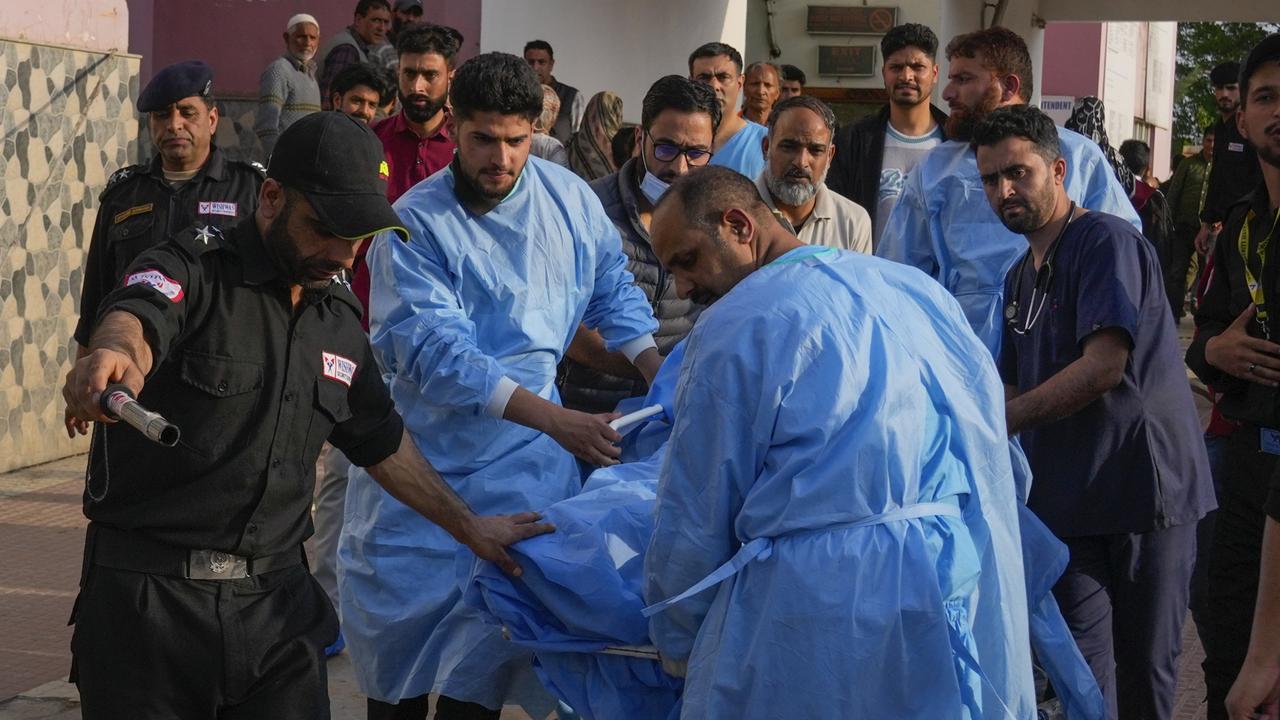 Paramedics carry a wounded tourist on a stretcher at a hospital in Anantnag after assailants fired at tourists visiting Pahalgam. Picture: AP Photo/Dar Yasin