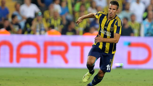 Robin van Persie of Fenerbahce runs for a ball.