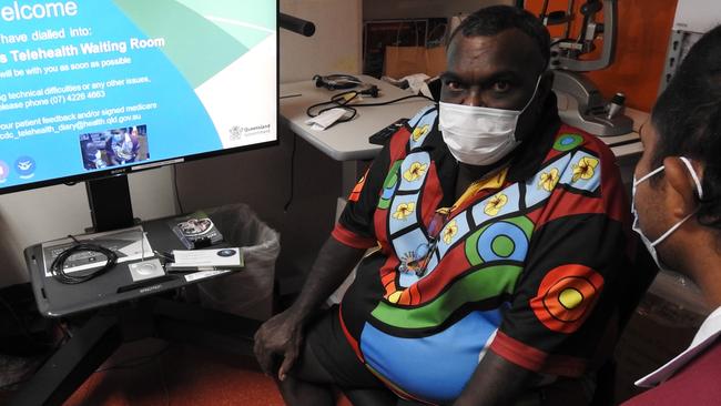 Yarrabah resident Stewart King with Gurriny Yealamucka health worker Rodderick Duncan (right), said the unreliable mobile coverage in the town often meant telehealth appointments are unavailable. Picture: Supplied