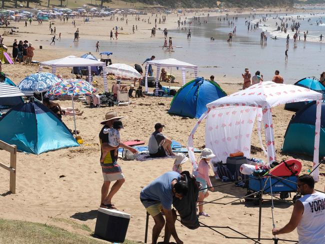 Torquay Cosy corner beach has had an Algae outbreak but that did not stop people going in the water.Picture: Mark Wilson
