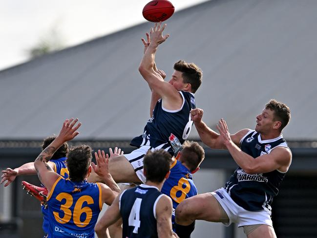 WRFL: Hoppers Crossing’s Nick Sing soars high. Picture: Andy Brownbill