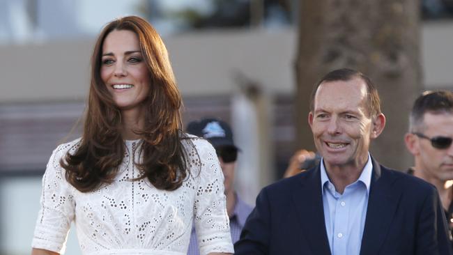 Britain's Kate, the Duchess of Cambridge, left, arrives at a surf lifesaving demonstration with Tony Abbott. Picture: Jason Reed.