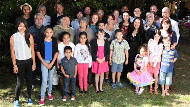 Mundine, pictured with his extended family, said he has lived all over the country.