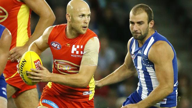 Gary Ablett leaves the Kangaroos in his wake. Picture: George Salpigtidis