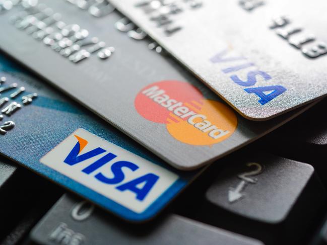 Bangkok, Thailand - Jun 23, 2015 : Group of credit cards on computer keyboard with VISA and MasterCard brand logos